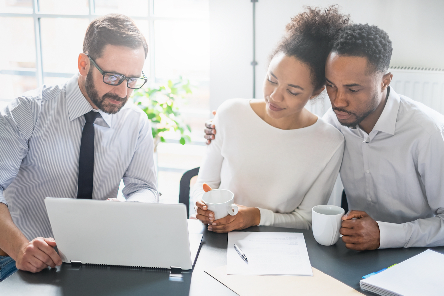 Young couple talking about insurance with a new agent