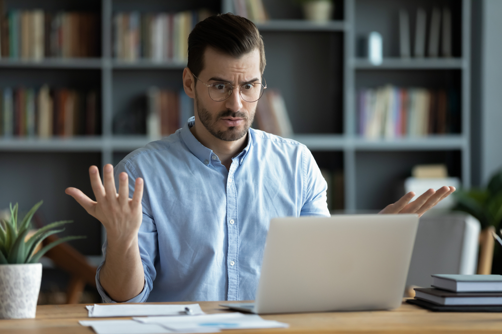 Person looking confused at a laptop