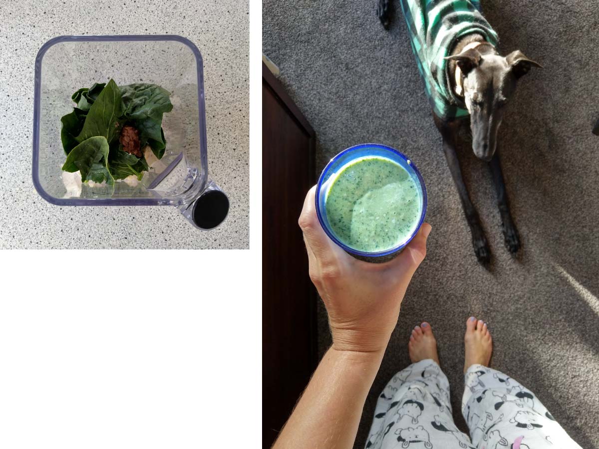 Cup of green smoothie in hand
