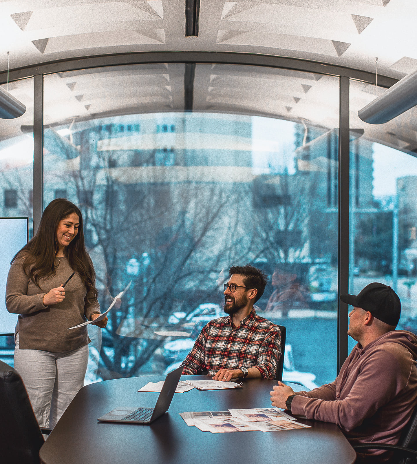 Leadline team members at a meeting table discussing a project