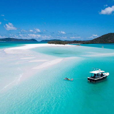 Boat moored at Whitehaven Beach