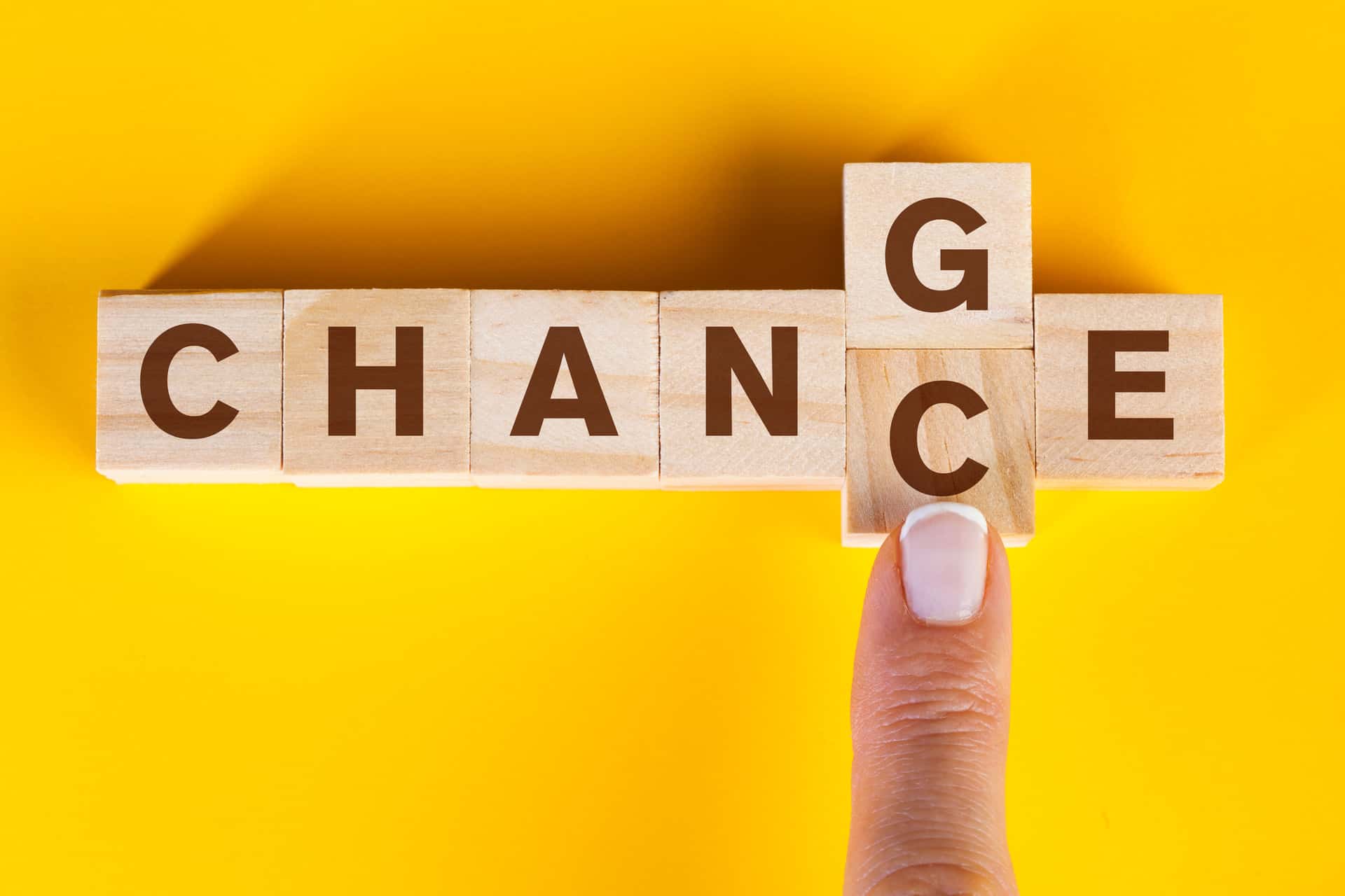 Wood blocks spelling out either change or chance