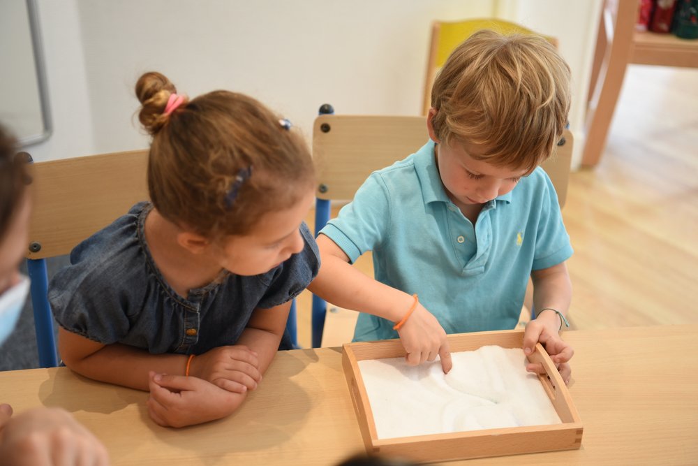 Child learns how to write letters