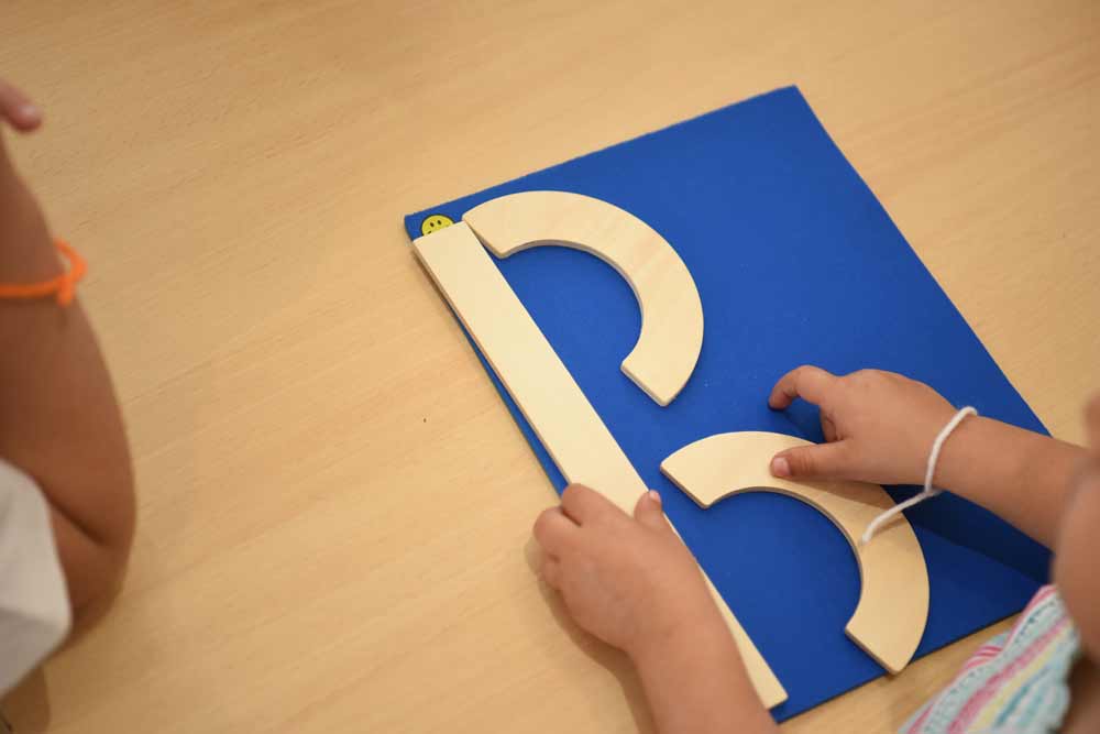 A child learning alphabet in L'Ecole Koenig