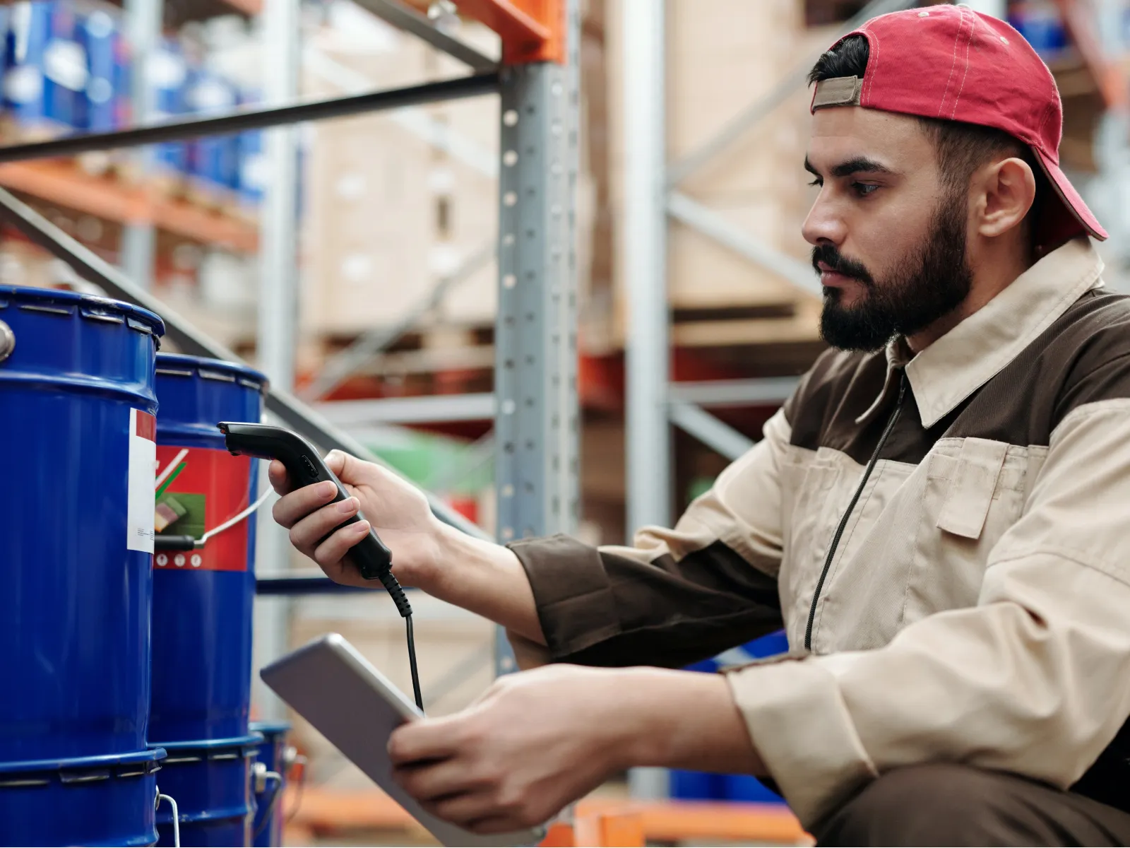 Factory inspector checking the products with the code reader
