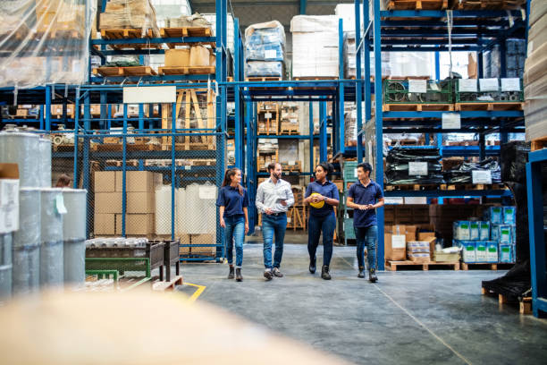 Group of people walking around factory