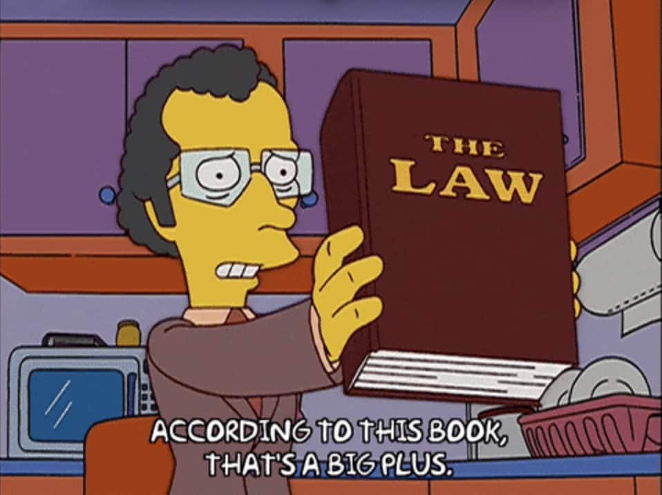 un personnage des Simpson tiens un livre de lois