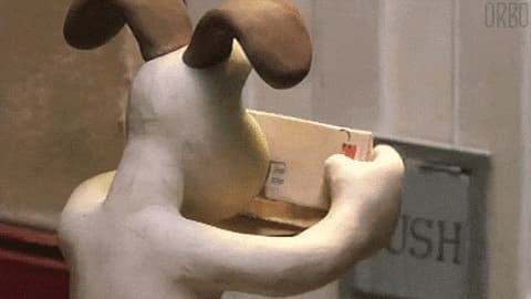 un chien en pate à modeler tri son courrier