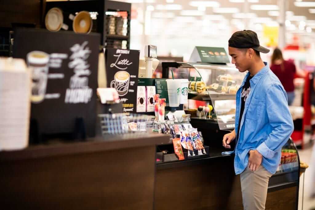 Starbucks Customer Picking Up Coffee Order