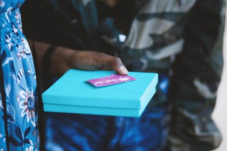 lady holding blue gift