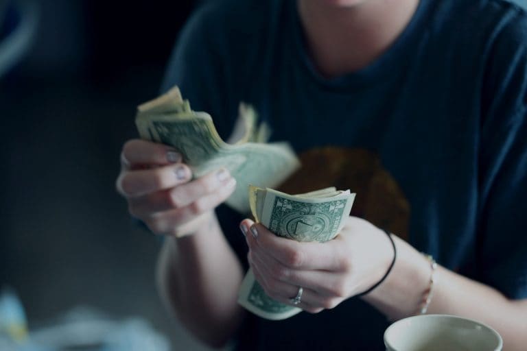 hands holding money