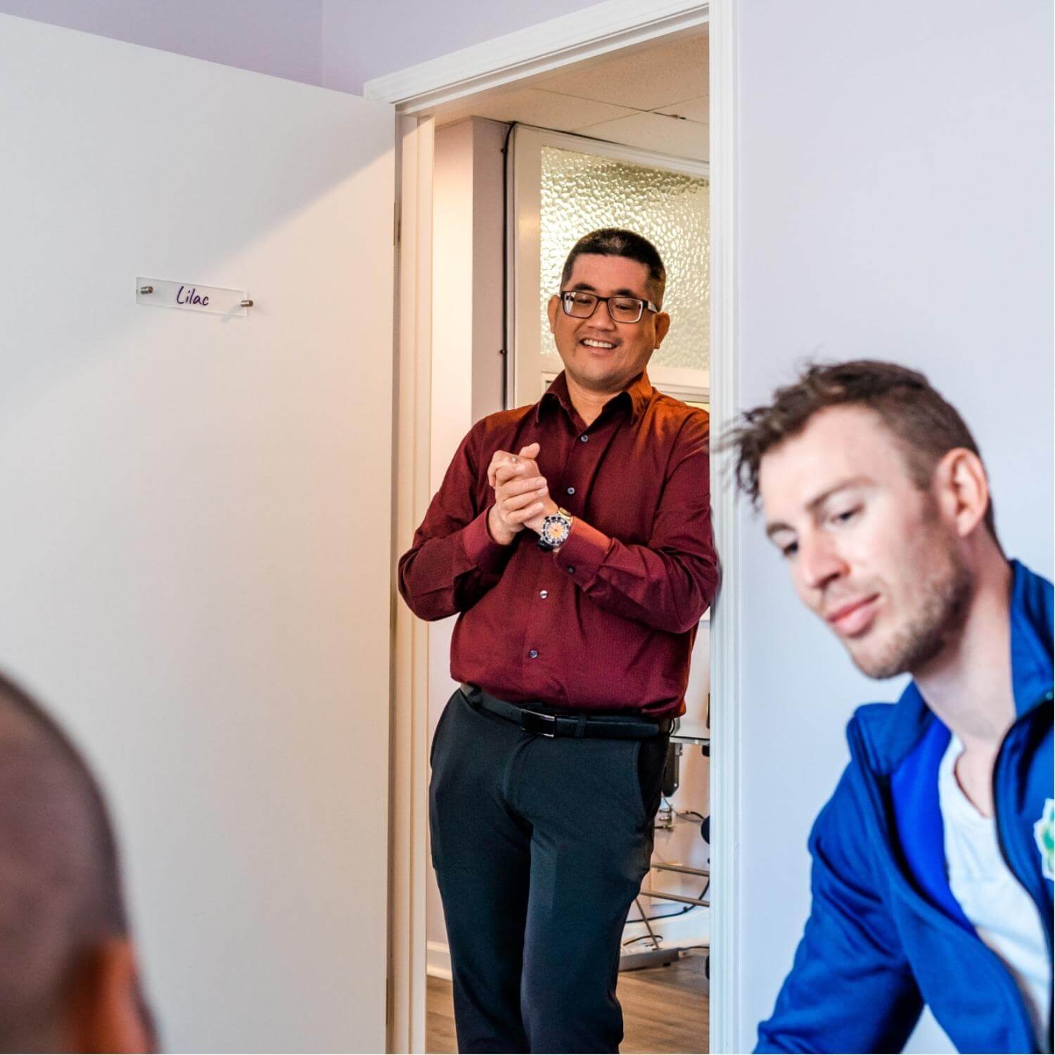 Doctor standing at the door of a doctor's office