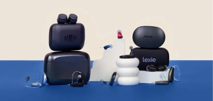 Hearing aids atop a variety of sculptures.