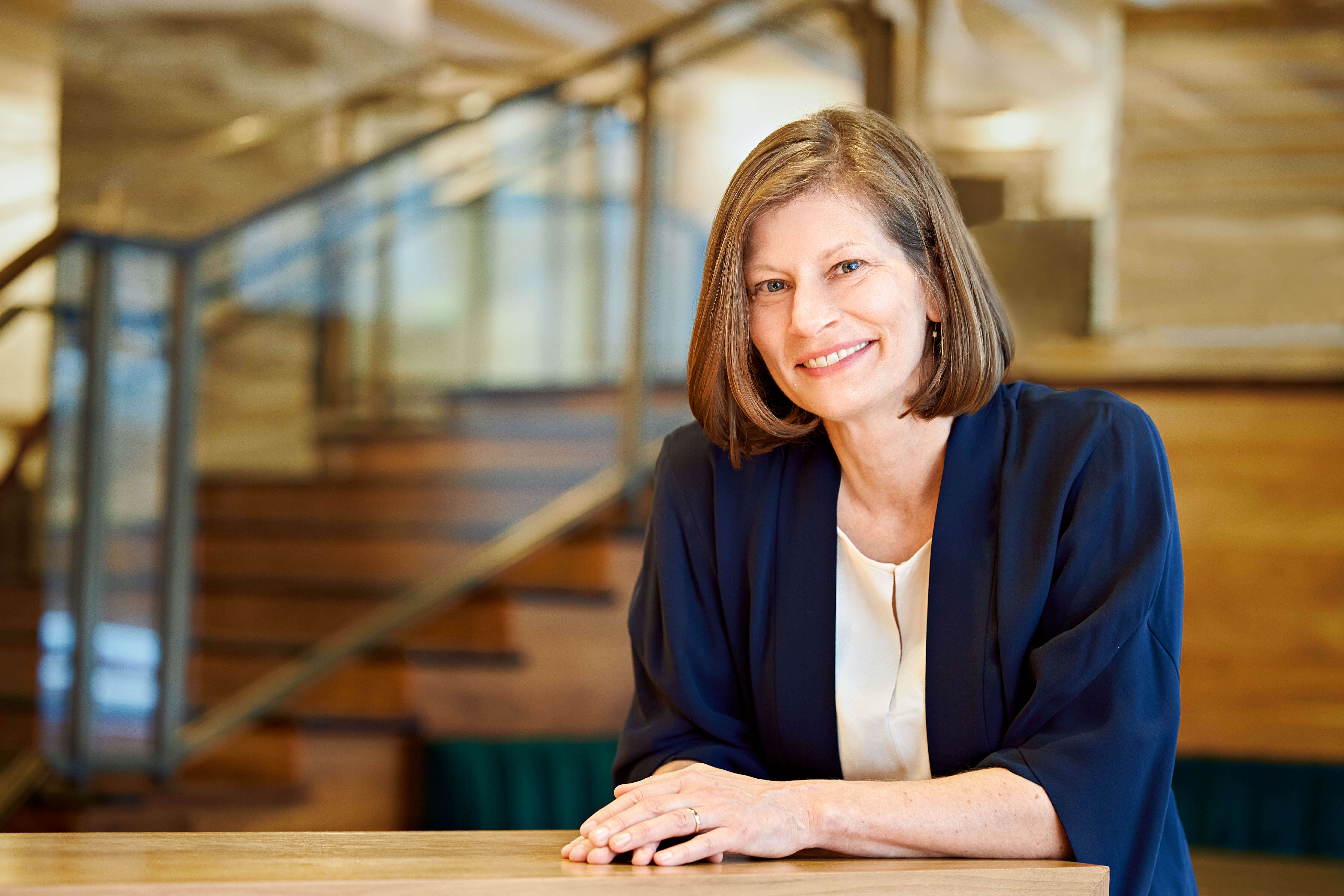 A photo of President Alyson Steele sitting at a table.