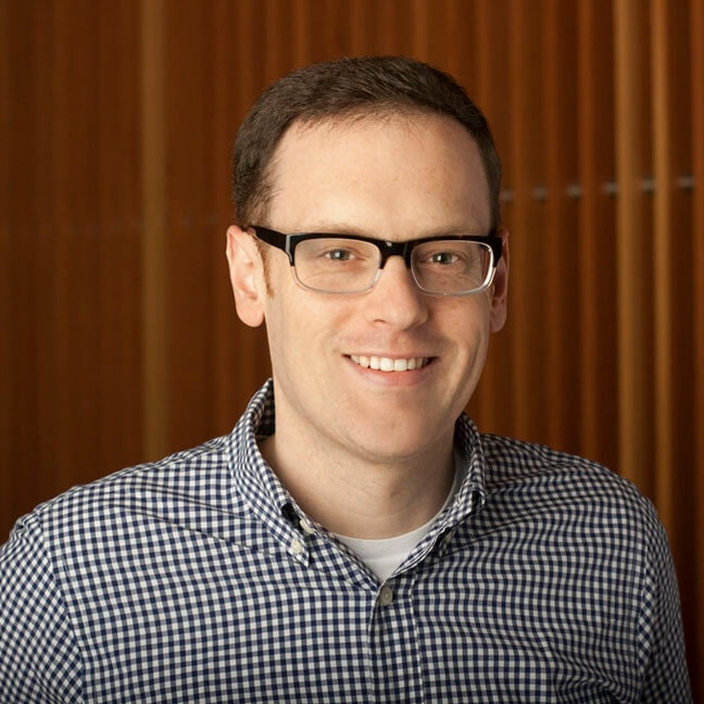 A headshot of Andrew Holloman.
