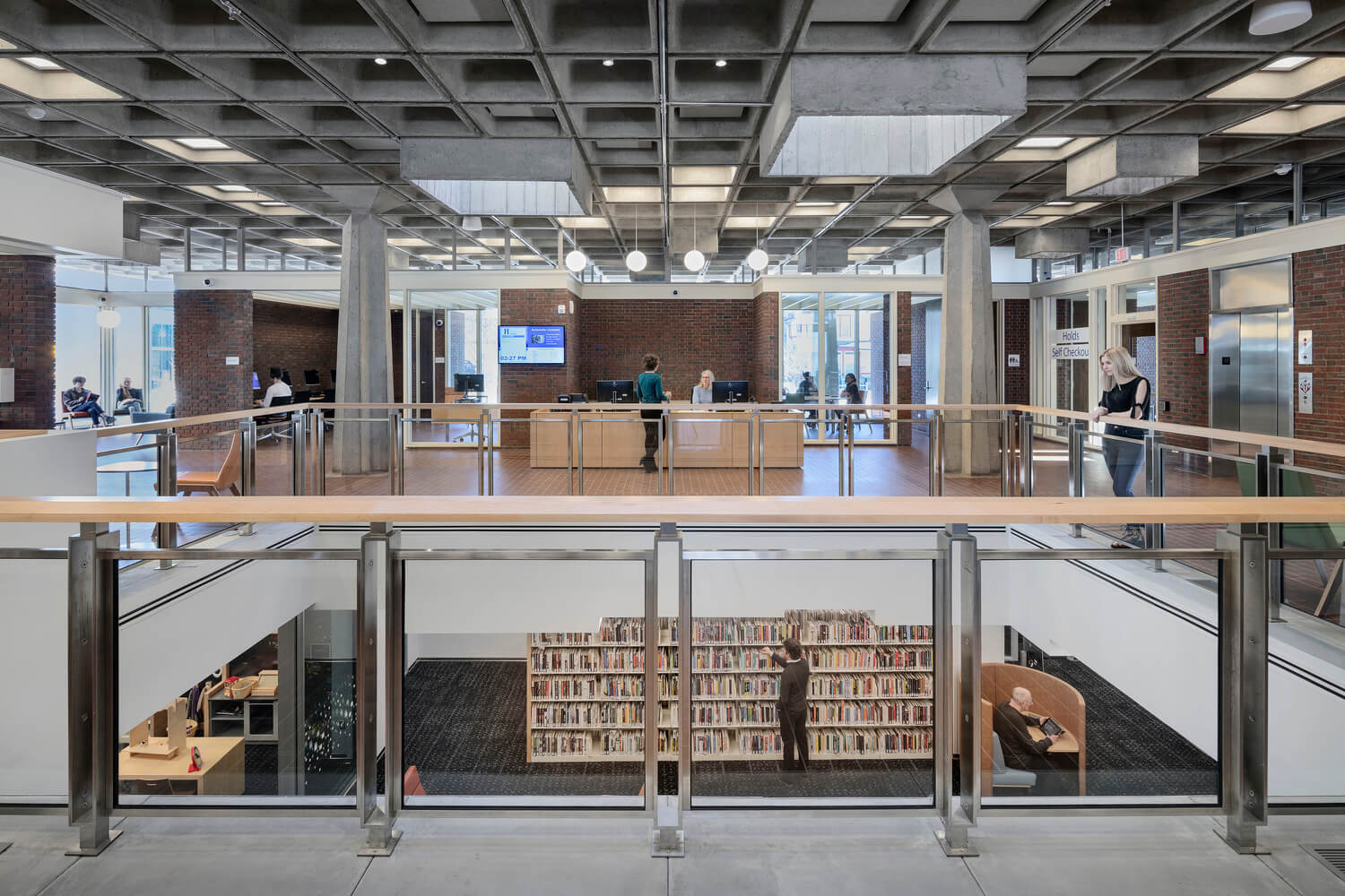 An interior photo of the library showing both levels.