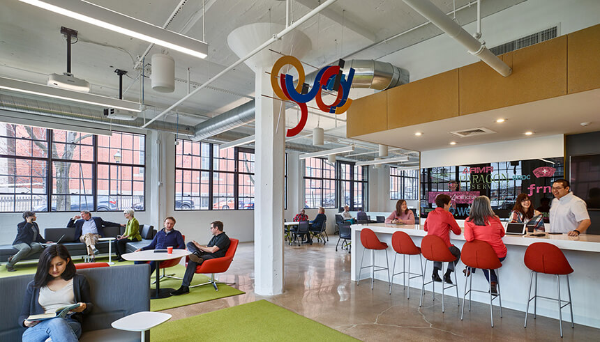 A photo of people working in a coworking space.