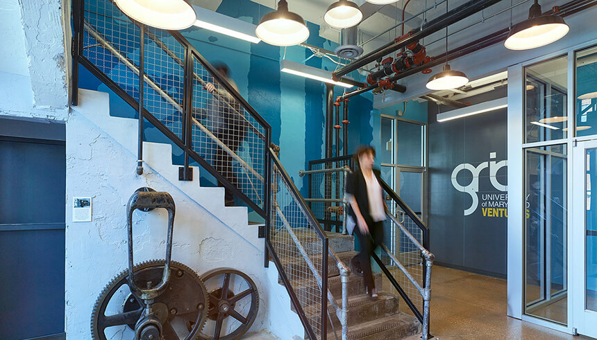 A photo of a woman descending a staircase.