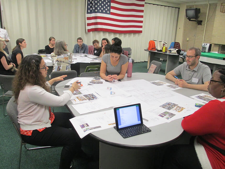 A photo of Jenine Kotob presenting design concepts during a 2015 workshop.