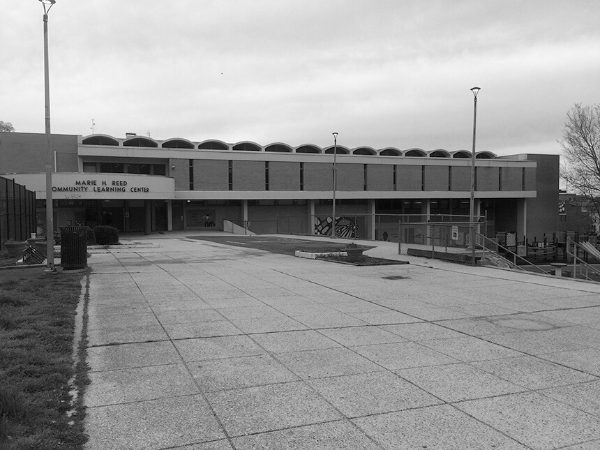 A photo displaying the original exterior of the Marie Reed Community Learning Center.