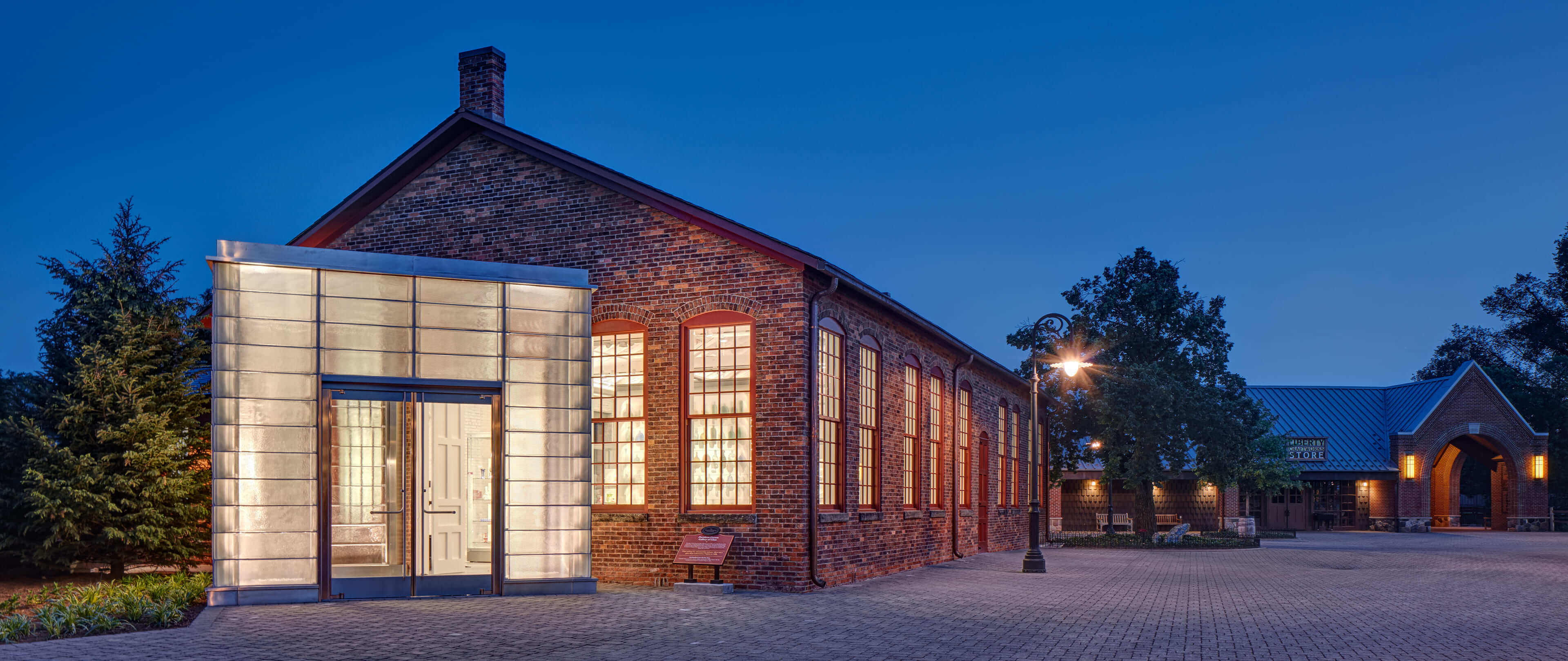 A photo of a museum at nighttime.