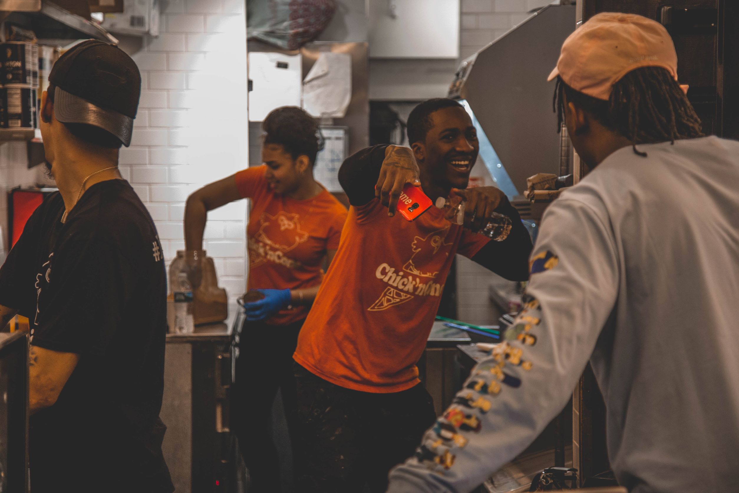 Group of employees in kitchen being happy