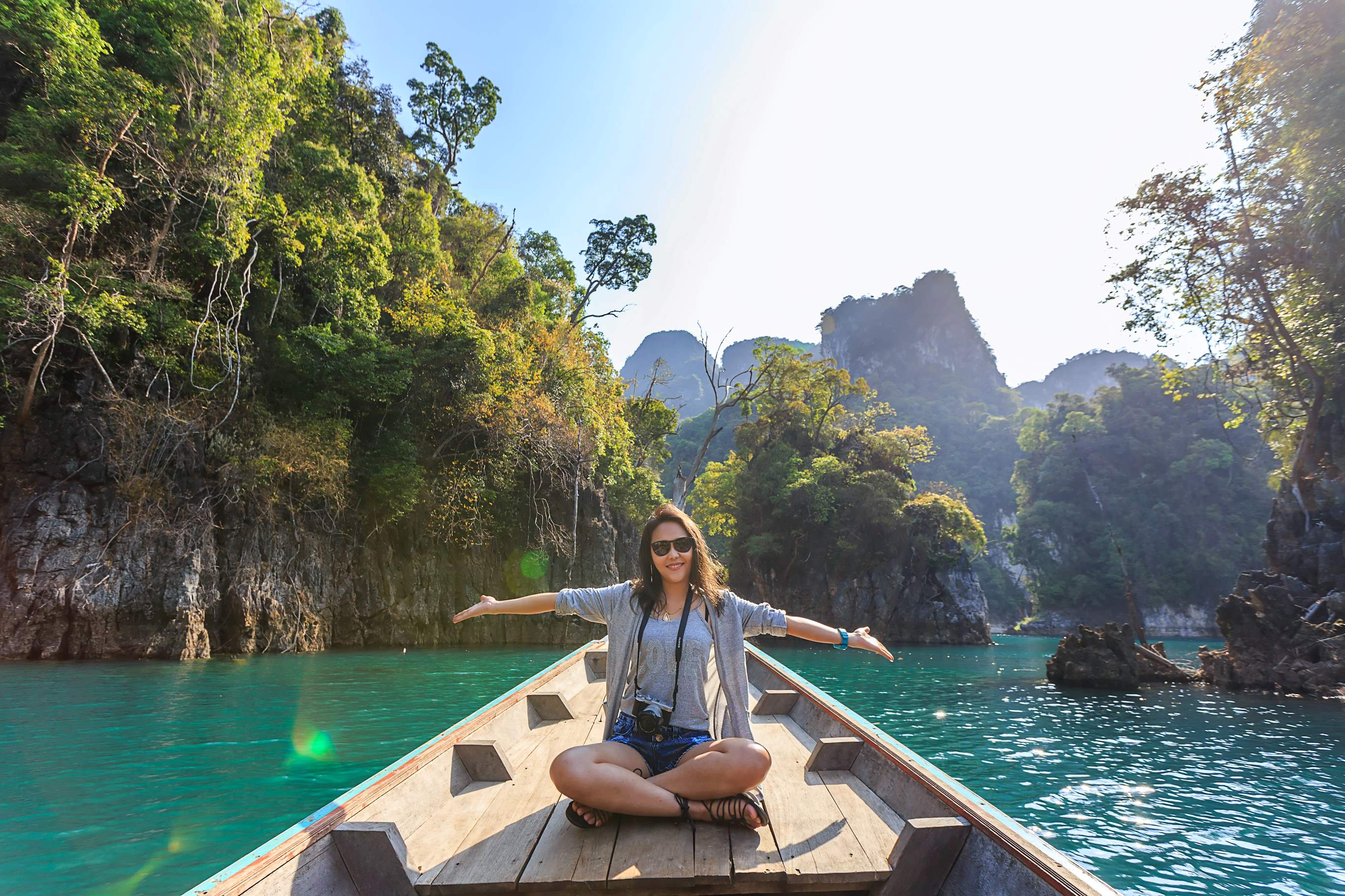 Woman on boat enjoying island vacation