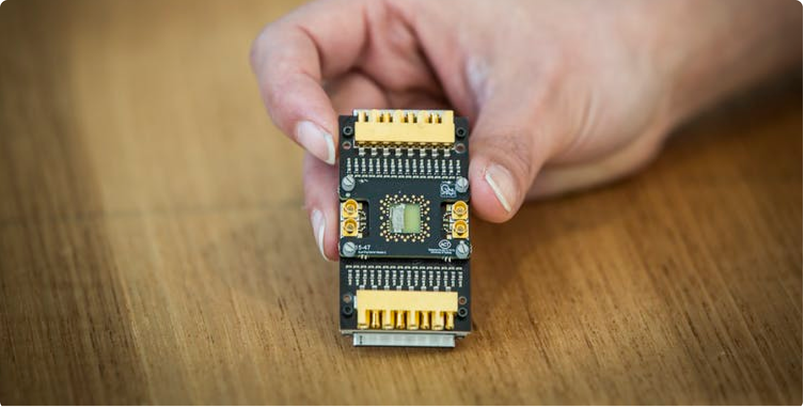 A semiconductor qubit device mounted on a custom cryogenic printed circuit board. <br>Image by Jayne Ion/University of Sydney.