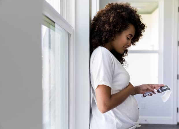 Pregant lady looking at photos