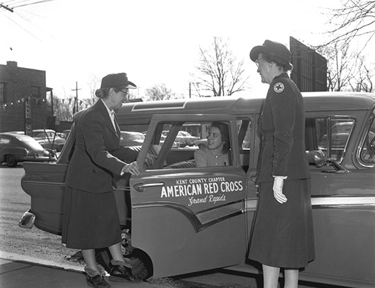 Red Cross Car and Patient Promotional Photo, February 20, 1957