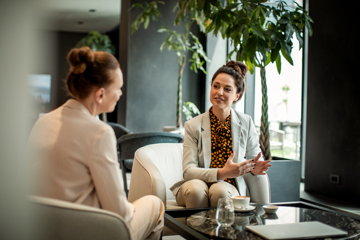 A woman working with a tax or accounting client.