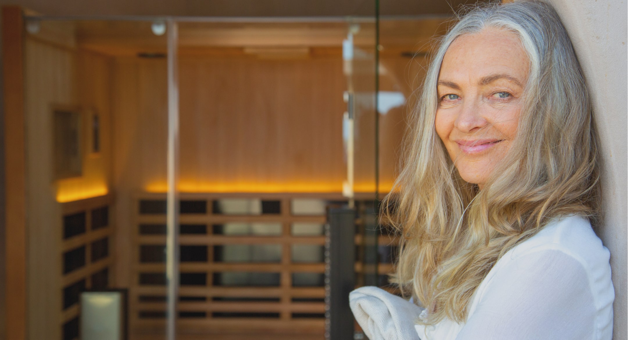 Woman smiling outside of sauna