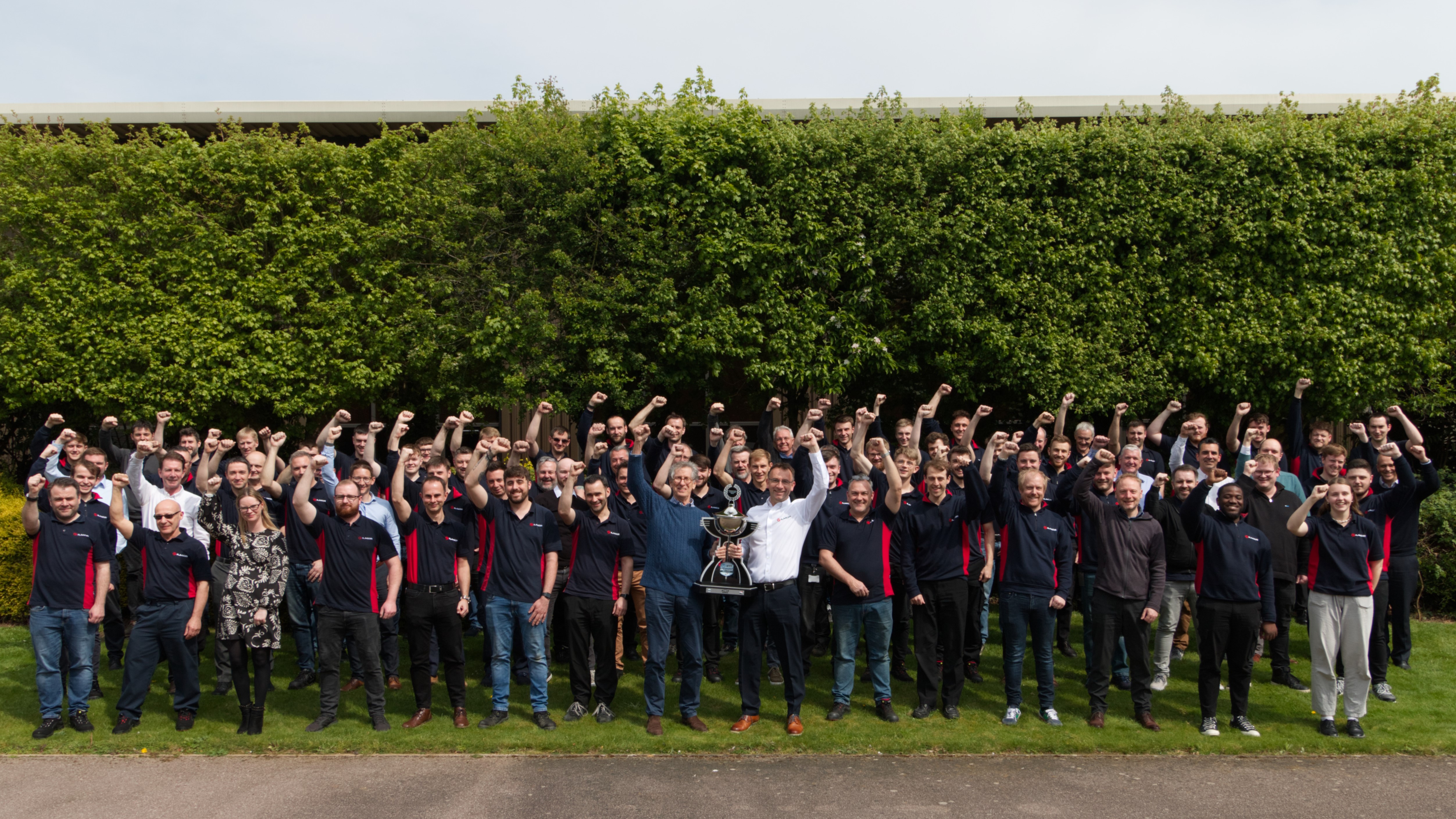 The entire Ilmor Engineering team with the 2022 NTT Trophy
