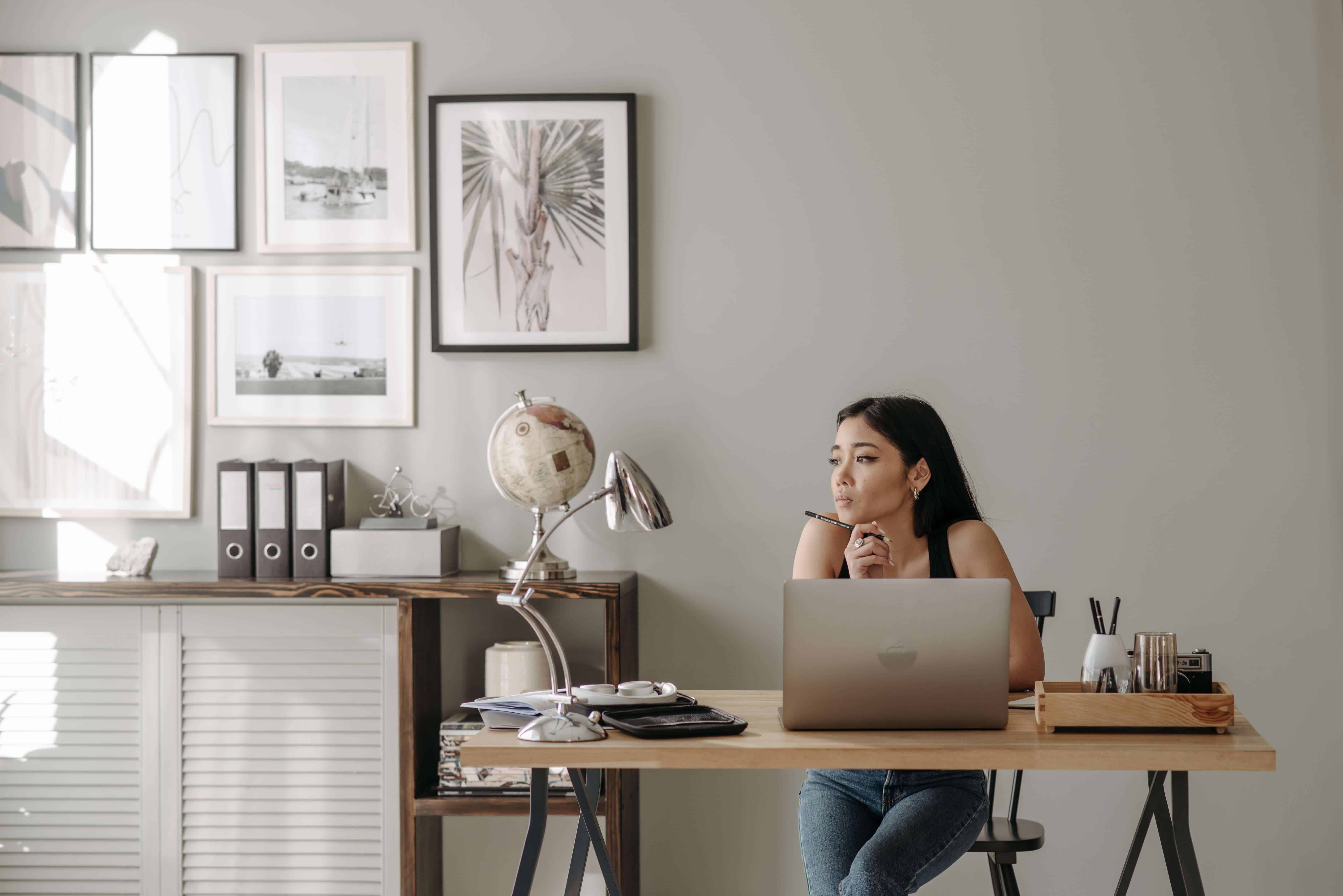 How to Practice Positive Self Talk at Work - woman working at desk at home