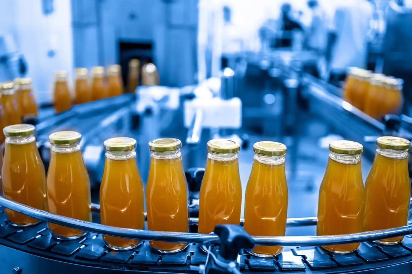A row of bottles on a manufacturing line