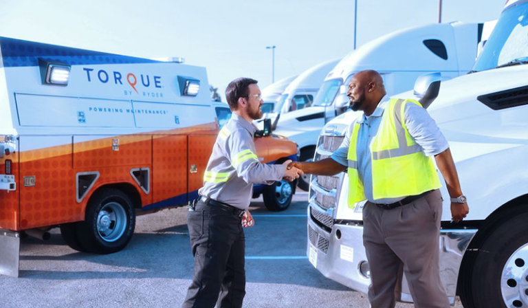 Torque mobile fleet maintenance expert and the truck driver shaking hands after servicing the fleet truck