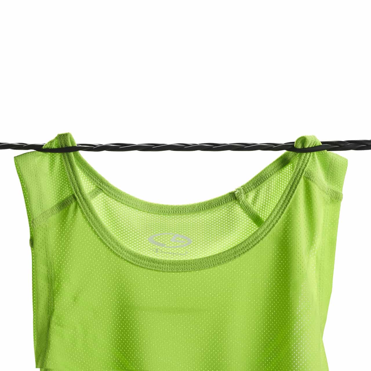 Green shirt hung on latex clothes line for travel